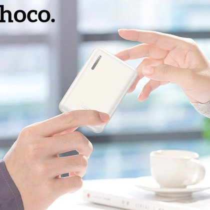HOCO 5000 mAh Power Bank. Fast Charge. 18.5Wh. Output, two USB A ports. Input, USB-C & Micro USB. J115. iPhone, Android, Tablet, iPad. White.